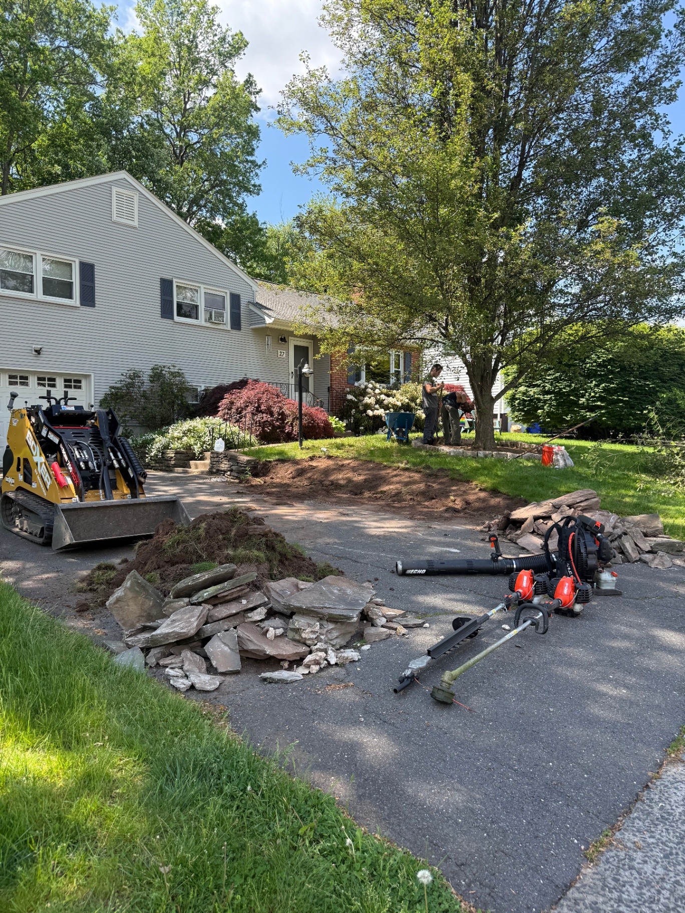 Hardscape demo and prep with mini skid steer