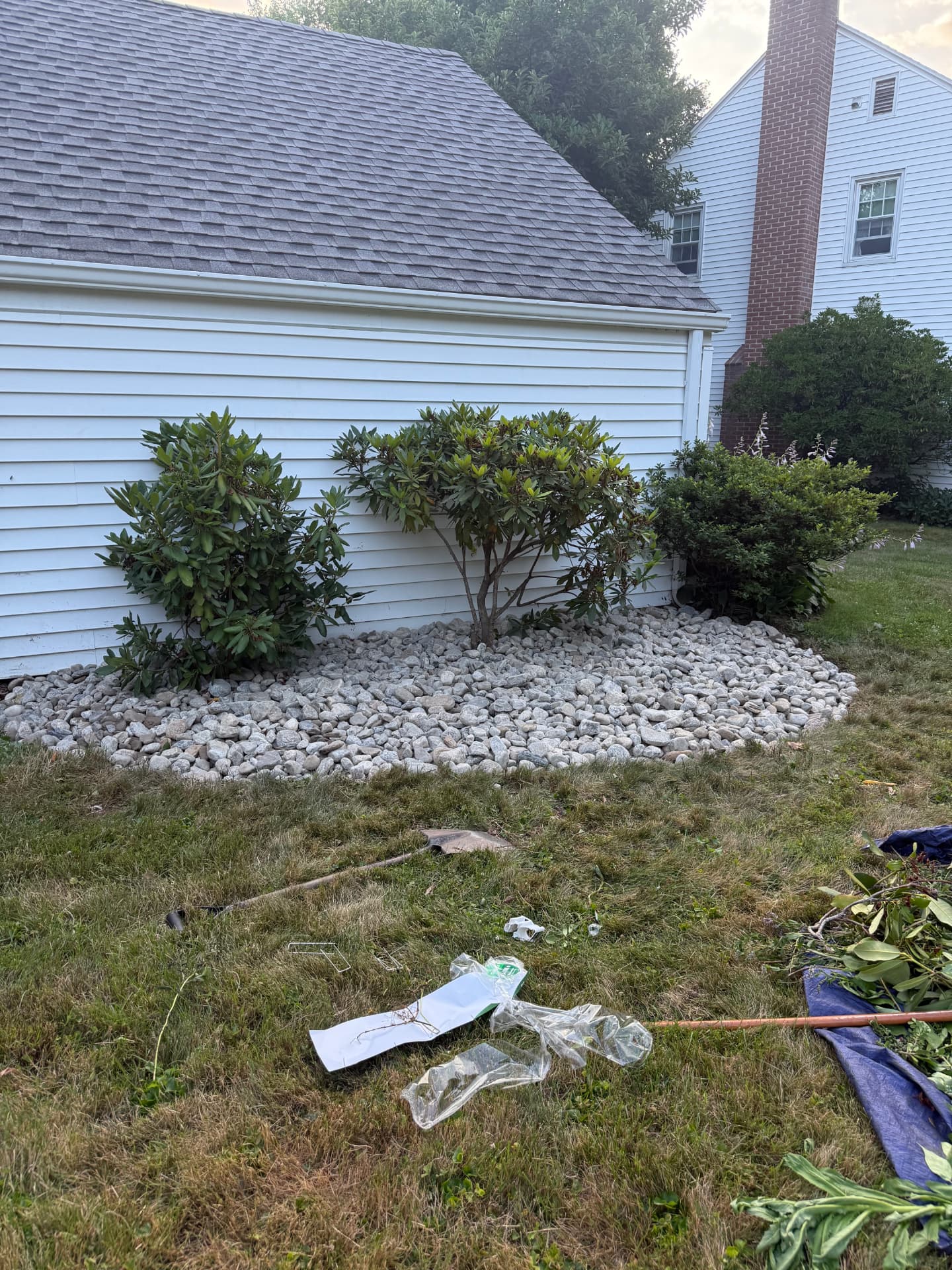 River rock bed installed along a house foundation