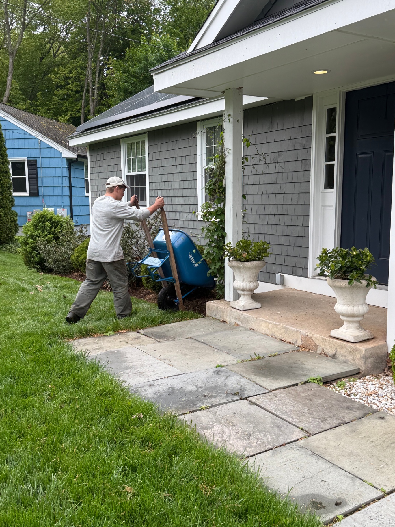 Crew working on front yard bed maintenance